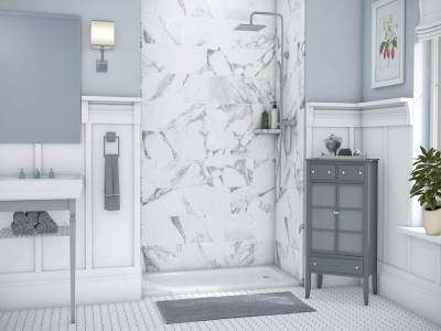 A bathroom remodel with white walls and marble floors. - bathroom remodeling and renovation from Oasis Bath Solutions of Kent Washington