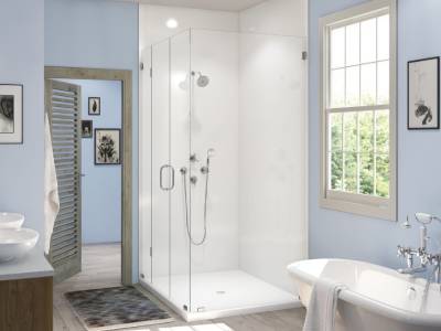 A bathroom remodel with blue walls and a glass shower stall. - bathroom remodeling and renovation from Oasis Bath Solutions of Kent Washington