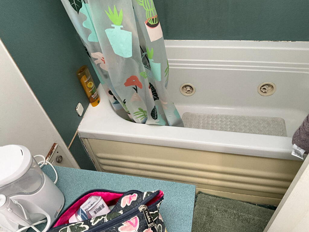 A bathroom with a bathtub and a sink next to it - bathroom remodeling and renovation from Oasis Bath Solutions of Kent Washington