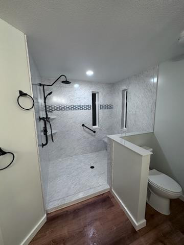 A bathroom with a walk in shower and toilet - bathroom remodeling and renovation from Oasis Bath Solutions of Kent Washington