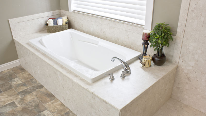 A bathroom with a bathtub and a window - bathroom remodeling and renovation from Oasis Bath Solutions of Kent Washington