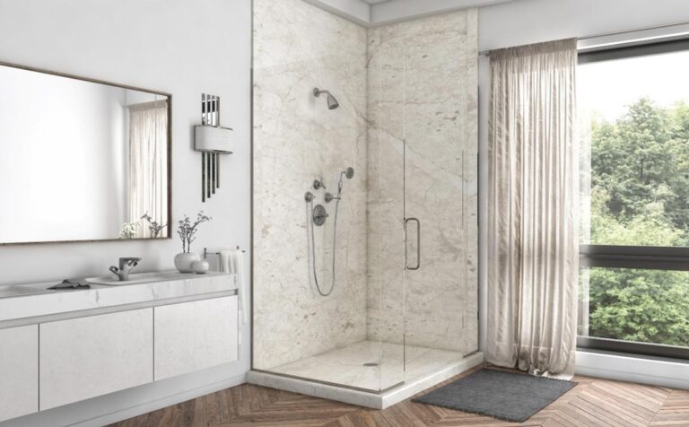 Modern bathroom interior with a glass shower enclosure, white vanity, large mirror, and a window with a view of greenery. Explore tub to shower conversion financing options available. Bathroom remodeling and renovation from Oasis Bath Solutions of Kent Washington